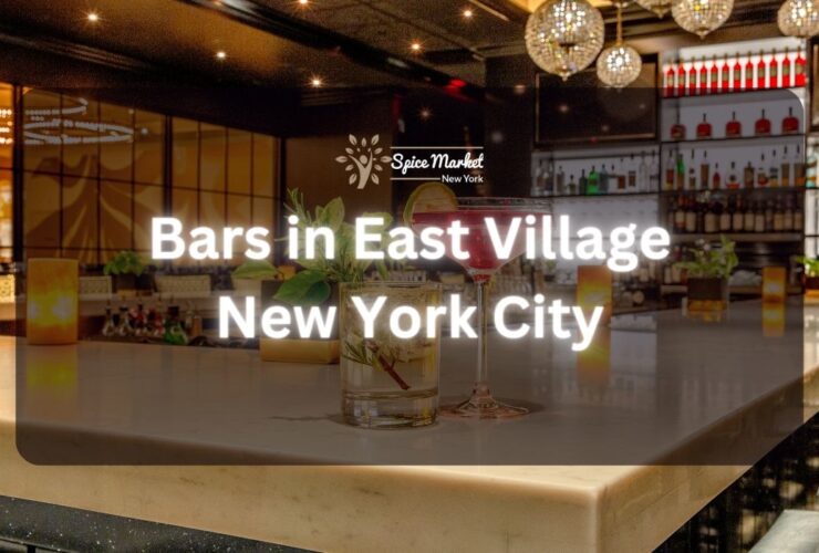 Bars in East Village New York City - a bar with nice lights and good ambience, 2 glass of cocktails, and candlelights on the table