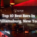 Top 10 Best Bars In Williamsburg New York - a bar counter with beautiful lights and different kinds of alcohol