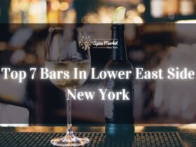Top 7 Bars In Lower East Side New York - a bar with good lighting, a bottle and glass of alcohol on a table