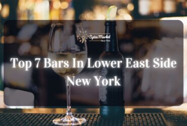 Top 7 Bars In Lower East Side New York - a bar with good lighting, a bottle and glass of alcohol on a table