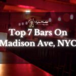 Top 7 Bars On Madison Ave, NYC - a bar with beautiful red dim lights