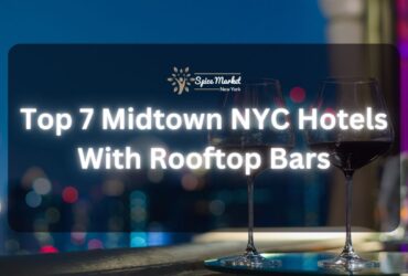 Top 7 Midtown NYC Hotels With Rooftop Bars - a rooftop bar with a table and 2 glasses of wine and a beautiful city lights view