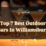 Top 7 Best Outdoor Bars In Williamsburg - a man serving 2 glasses of alcohol drinks next to two cocktails on a table