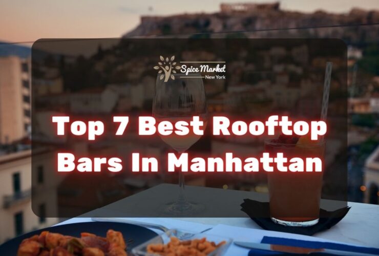Top 7 Best Rooftop Bars In Manhattan NYC - food and cocktails on a table with a nice view from a rooftop bar