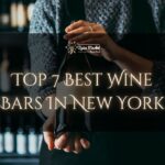 Top 7 Best Wine Bars In New York - a bartender holding a nice bottle of wine in a bar