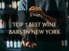Top 7 Best Wine Bars In New York - a bartender holding a nice bottle of wine in a bar