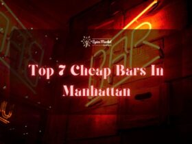 Top 7 Cheap Bars In Manhattan NYC - a bar sign that says "bar" in yellow colored lights