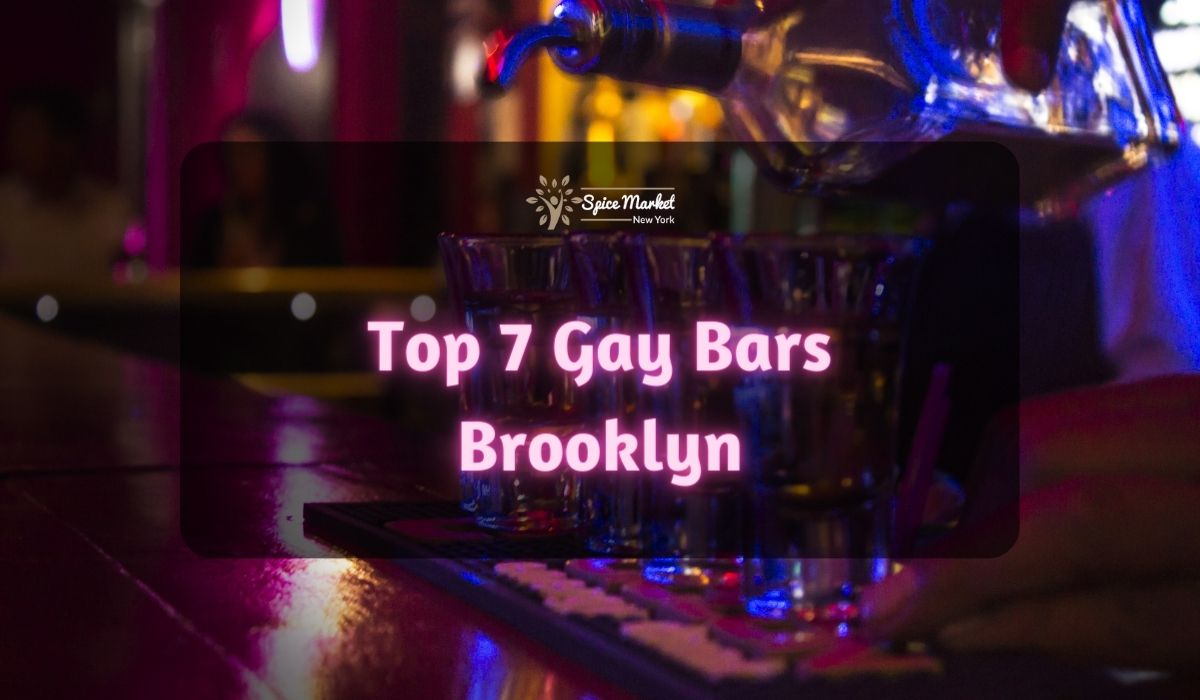 Top 7 Gay Bars Brooklyn NYC - a bartender pouring drinks on glasses on table inside a bar with nice lighting