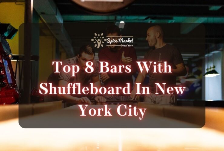 Top 8 Bars With Shuffleboard In New York City - three men playing with a shuffleboard while holding drinks at a bar